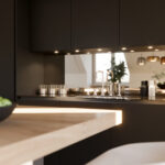 Detailbild einer schwarzen Küche mit verspiegelter Küchenrückwand.